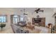 Open living room with ceiling fans, comfortable couches and tile flooring at 6408 Shoreline Ct, St Cloud, FL 34771