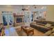 Inviting living room boasts stone fireplace, tile floor, and comfortable seating at 6408 Shoreline Ct, St Cloud, FL 34771