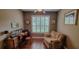 Comfortable office space with hardwood floors, neutral paint, and natural light at 6408 Shoreline Ct, St Cloud, FL 34771
