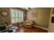 Comfortable office space with hardwood floors, neutral paint, and natural light at 6408 Shoreline Ct, St Cloud, FL 34771