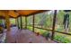 Screened porch with wooded backyard view at 6408 Shoreline Ct, St Cloud, FL 34771