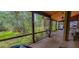 The screened porch overlooks a lush backyard at 6408 Shoreline Ct, St Cloud, FL 34771