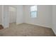 Well-lit bedroom with a large closet and neutral walls at 8740 Good Vibes Pl, Kissimmee, FL 34747