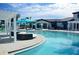 Resort-style community pool with ample seating, cabanas, and a luxurious lounging area for relaxation at 8956 Zurich Ln, Kissimmee, FL 34747