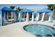 Inviting community hot tub with shade cabanas, providing a private and comfortable space to unwind at 8956 Zurich Ln, Kissimmee, FL 34747