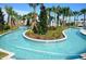 Scenic lazy river winding through lush landscaping, offering a peaceful and relaxing water experience at 8956 Zurich Ln, Kissimmee, FL 34747