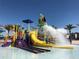 Community water park featuring colorful slides, a tipping bucket, and shallow water, perfect for Gathering fun at 8956 Zurich Ln, Kissimmee, FL 34747