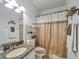 Clean bathroom with granite countertop and shower at 9564 Venezia Plantation Dr, Orlando, FL 32829