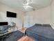Bedroom with a bed, desk and chair, and ceiling fan at 9564 Venezia Plantation Dr, Orlando, FL 32829
