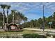 Community entrance with signage and landscaping at 9564 Venezia Plantation Dr, Orlando, FL 32829