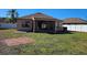 Back of house showing patio and fenced backyard at 9564 Venezia Plantation Dr, Orlando, FL 32829