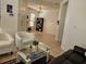 Bright living room featuring tile flooring, white walls, and an open layout at 9564 Venezia Plantation Dr, Orlando, FL 32829
