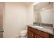 Bathroom with granite countertop and tiled shower at 11904 Founders St, Orlando, FL 32832
