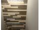 Stylish accent wall featuring horizontal planks of light and dark stained wood creates a unique design at 1341 Shinnecock Hills Dr, Davenport, FL 33896