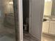 Modern bathroom with tiled shower, toilet, granite counters, and ample storage at 1341 Shinnecock Hills Dr, Davenport, FL 33896