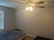 Neutral bedroom featuring a ceiling fan with lights and an air mattress on the floor at 1341 Shinnecock Hills Dr, Davenport, FL 33896