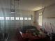 Spacious garage featuring a car, overhead door, and natural light enhancing functionality and appeal at 1341 Shinnecock Hills Dr, Davenport, FL 33896