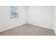 Spacious bedroom with neutral carpet and large window at 2121 Rosewood Dr, Bartow, FL 33830