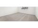 Spacious bedroom with neutral carpeting and window at 2121 Rosewood Dr, Bartow, FL 33830
