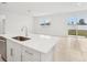 Modern kitchen island with white cabinets and stainless steel appliances at 2121 Rosewood Dr, Bartow, FL 33830