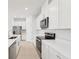 Modern kitchen with white cabinets and stainless steel appliances at 2121 Rosewood Dr, Bartow, FL 33830