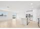 Bright kitchen with white cabinets, stainless steel appliances, and a large island at 2121 Rosewood Dr, Bartow, FL 33830