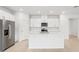 Modern kitchen with white cabinets, stainless steel appliances, and an island at 2121 Rosewood Dr, Bartow, FL 33830