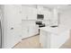 Modern kitchen with white cabinets, stainless steel appliances, and an island at 2121 Rosewood Dr, Bartow, FL 33830