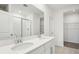 Bathroom with double vanity, shower, and closet at 2125 Rosewood Dr, Bartow, FL 33830