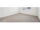 Simple bedroom with carpet flooring and two windows at 2125 Rosewood Dr, Bartow, FL 33830