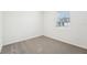 Simple bedroom with neutral carpeting and window at 2125 Rosewood Dr, Bartow, FL 33830