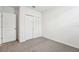 Simple bedroom with double door closet and neutral carpeting at 2125 Rosewood Dr, Bartow, FL 33830