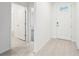 Bright and spacious entryway with tile flooring and access to bathroom and another room at 2125 Rosewood Dr, Bartow, FL 33830