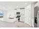 Modern kitchen with white cabinets, stainless steel appliances, and an island at 2125 Rosewood Dr, Bartow, FL 33830