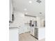 Modern kitchen with white cabinets, stainless steel appliances, and an island at 2125 Rosewood Dr, Bartow, FL 33830