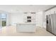 Modern kitchen with white cabinets, stainless steel appliances, and an island at 2125 Rosewood Dr, Bartow, FL 33830