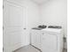 Laundry room with washer, dryer, and a door at 2125 Rosewood Dr, Bartow, FL 33830