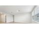 Spacious living room with wood-look floors and multiple windows at 2125 Rosewood Dr, Bartow, FL 33830