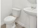 Simple bathroom with pedestal sink and toilet at 2137 Rosewood Dr, Bartow, FL 33830