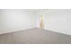 Spacious bedroom with plush carpeting and access to a private bathroom at 2137 Rosewood Dr, Bartow, FL 33830