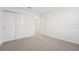 Well-lit bedroom with double doors leading to the bathroom at 2137 Rosewood Dr, Bartow, FL 33830