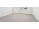 Spacious bedroom with carpet flooring and an adjacent bathroom at 2137 Rosewood Dr, Bartow, FL 33830