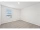 Bright bedroom featuring a window with blinds and grey carpet at 2137 Rosewood Dr, Bartow, FL 33830