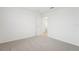 Light and airy bedroom with door to hallway at 2137 Rosewood Dr, Bartow, FL 33830