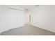 Spacious bedroom with double-door closet and grey carpet at 2137 Rosewood Dr, Bartow, FL 33830