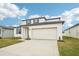 Two-story house with gray door and white siding at 2137 Rosewood Dr, Bartow, FL 33830