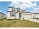 Two-story house with gray door and white siding at 2137 Rosewood Dr, Bartow, FL 33830