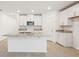 Modern kitchen with white cabinets, granite countertops and island at 2137 Rosewood Dr, Bartow, FL 33830