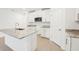 Modern kitchen with white cabinets, granite countertops, and stainless steel appliances at 2137 Rosewood Dr, Bartow, FL 33830