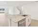 Island kitchen features granite countertops and stainless steel dishwasher at 2137 Rosewood Dr, Bartow, FL 33830